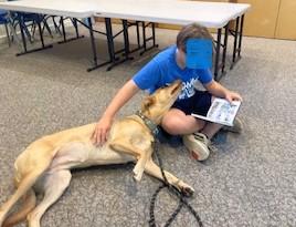 Child reading to Kaya
