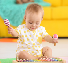 Child making music